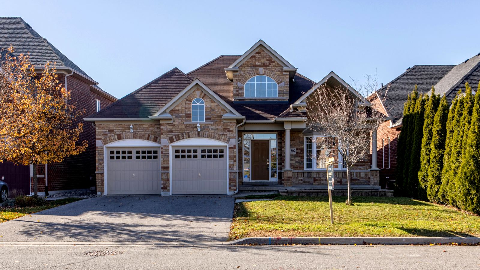 Suburban brick home with a double garage