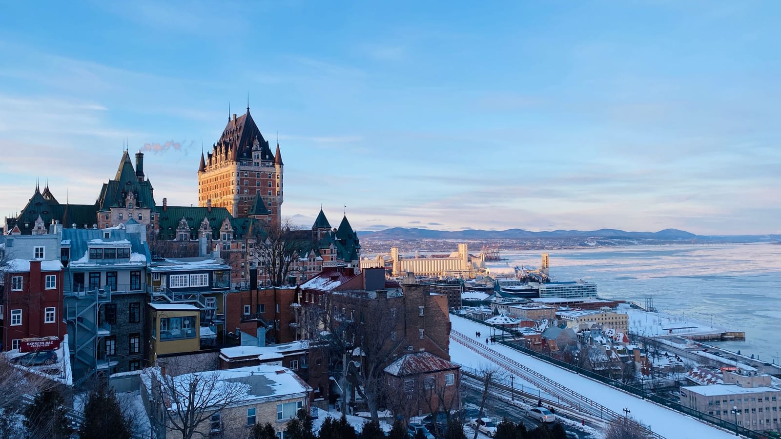 Snow-covered rooftops of Old Quebec above the frozen river